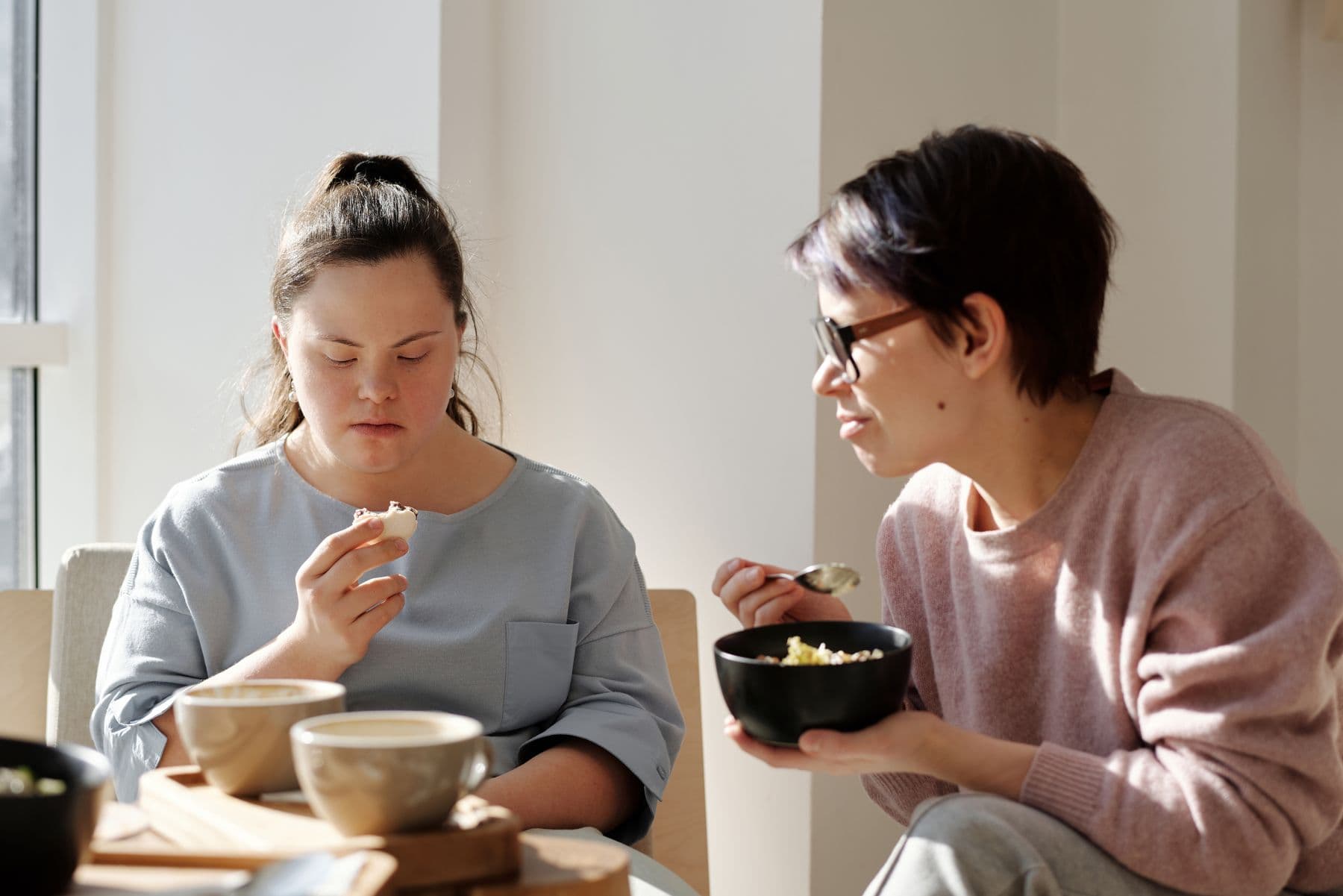 Two women enjoying a happy meal and conversation together
